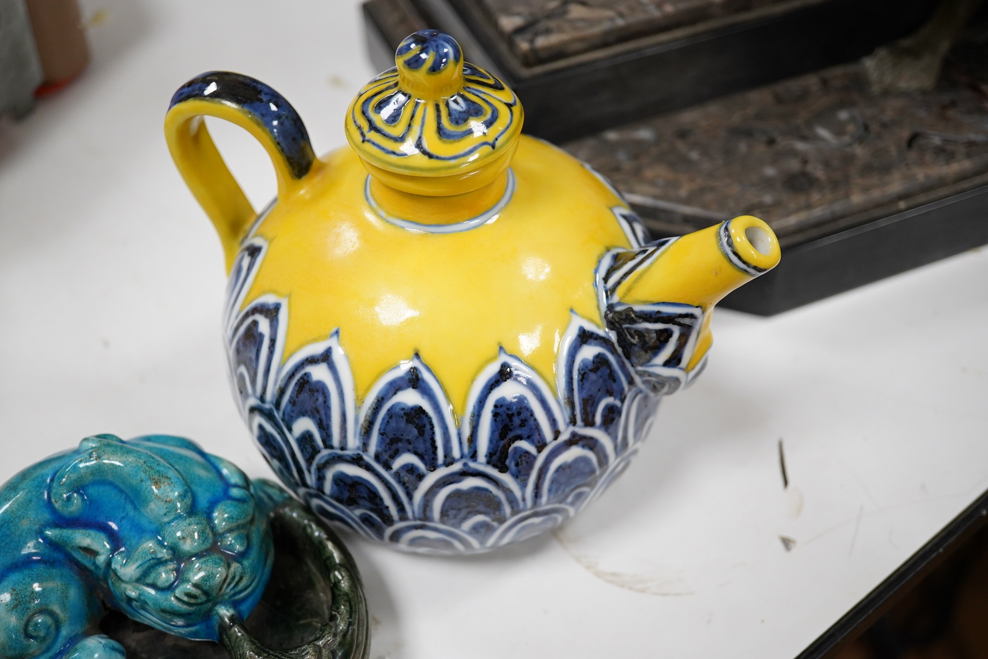 A Chinese yellow ground teapot, Xuande mark but later and a turquoise glazed ‘lion dog’ brush washer, tallest 13cm. Condition - good